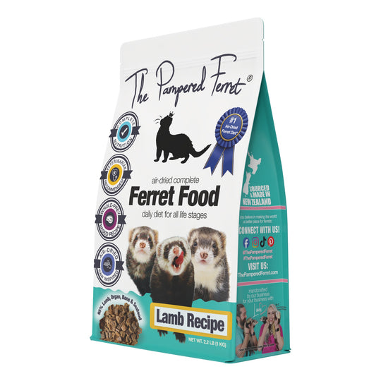 A bag of The Pampered Ferret Air-Dried Lamb Recipe Complete Ferret Food, featuring a white and teal design with a black ferret silhouette, several real ferret photos on the front, and product details for lamb dry ferret food